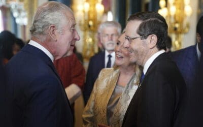 Op kroningsreceptie zou koning Charles president Herzog prijzen voor bemiddeling bij reorganisatie